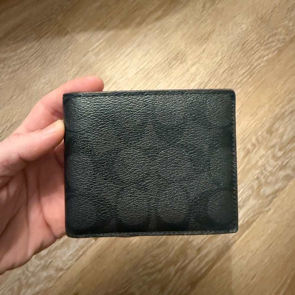 Men’s bifold Coach wallet.
